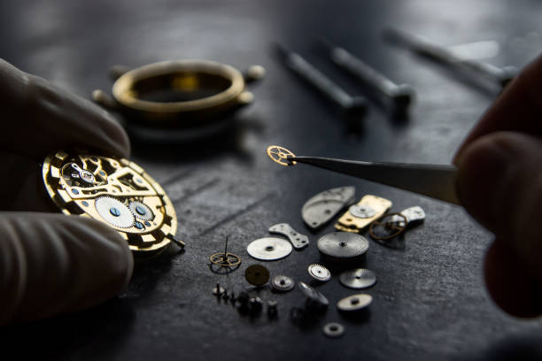 Watchmaker is repairing the mechanical watches in his workshop